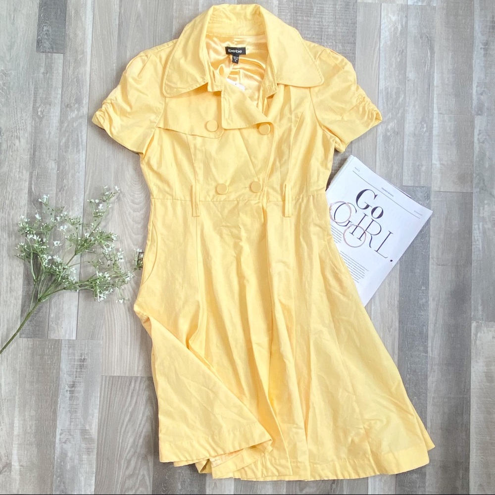 NWT Bebe yellow short sleeve full skirt trench size M